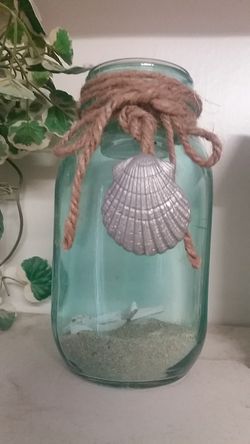 NEW CANDLE HOLDER WITH SHELLS, CANDLE ON TOP.