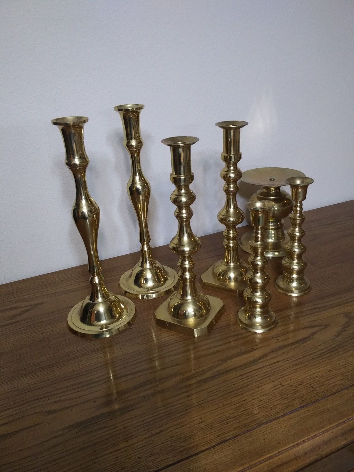 7 vintage brass candlesticks