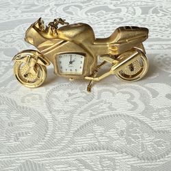 This Collectible Motorcycle theme Mini-Clock is a unique and vintage piece that will make a great addition to any collection. With a gold color and ma