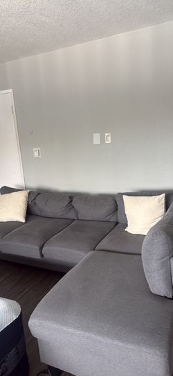Gray L shape sectional couch