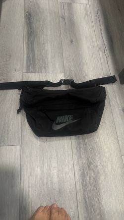 black Nike Tech Hip Pack features a large reflective Swoosh logo.