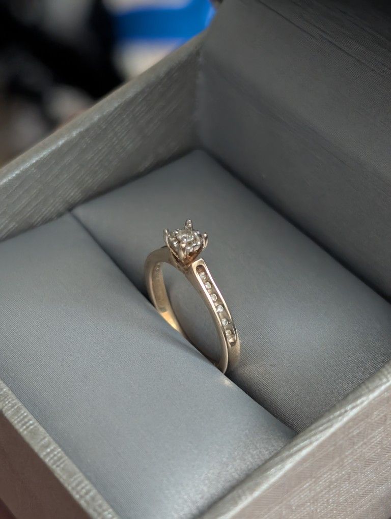 Gold Ring With Little Diamonds Around 