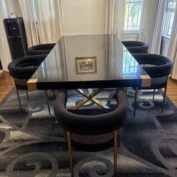 Black dining room table with chairs