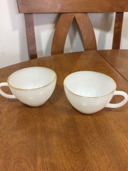 Pair of vintage fire king coffee mugs