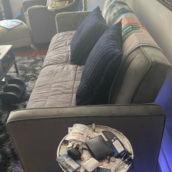 Suede couch that has been covered whole time