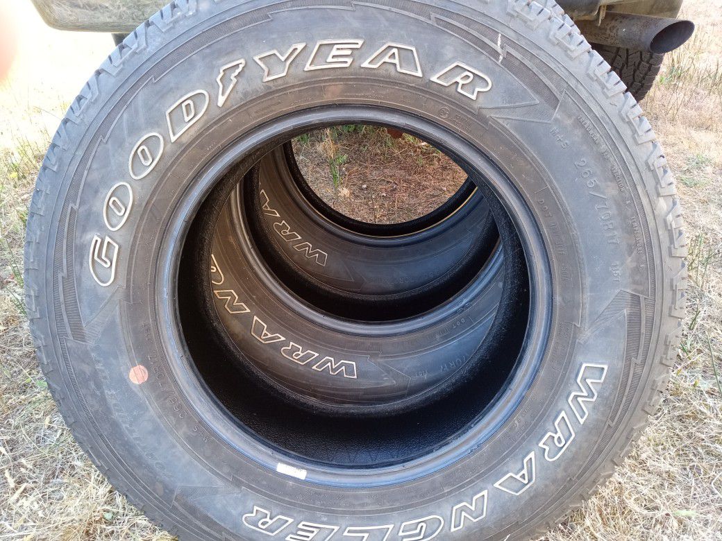 Three Goodyear Wrangler Tires