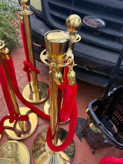 Gold Stanchion Posts with Red Velvet Ropes