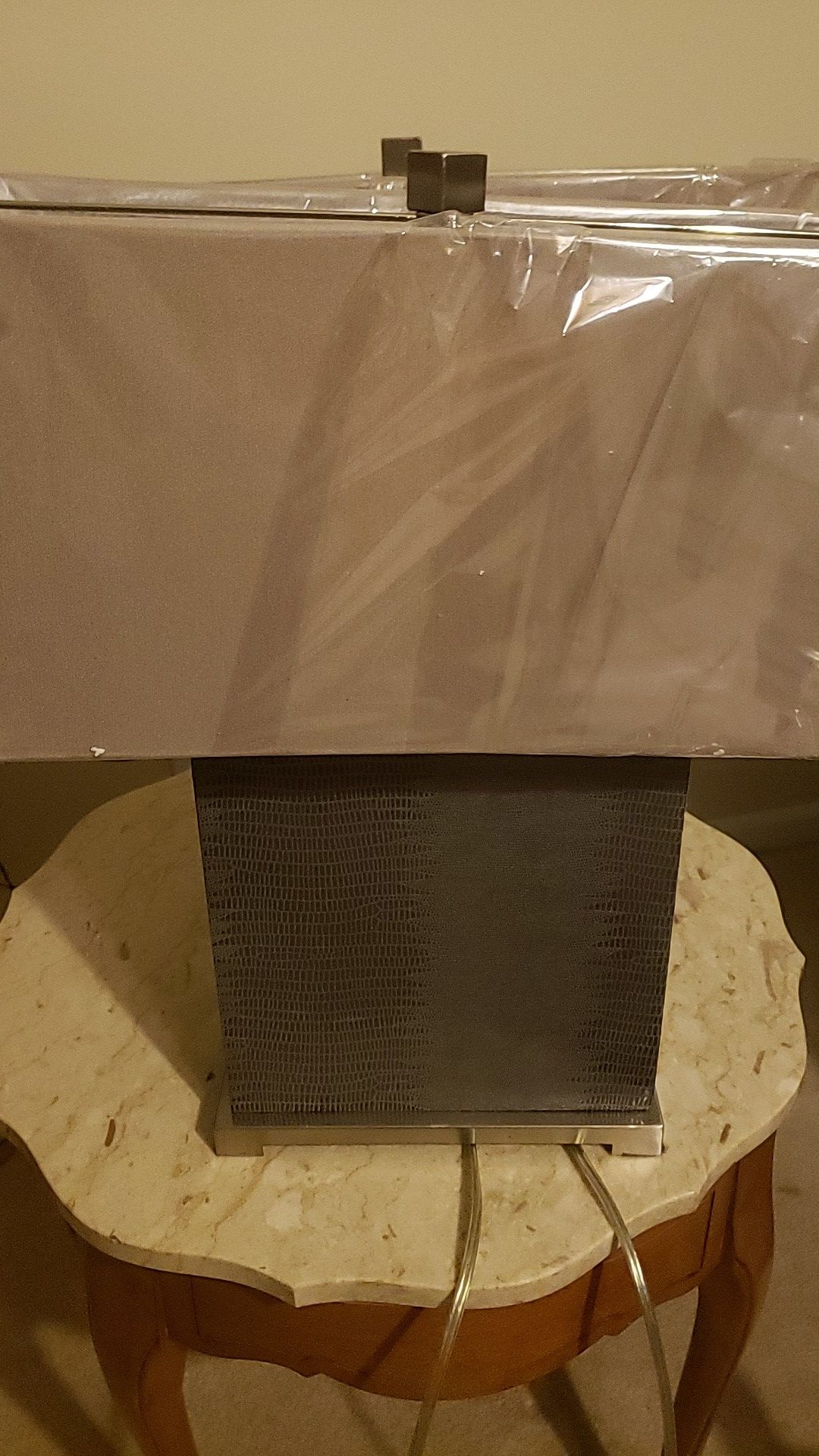 beautiful square dark grey lamps with light gray shades. plastic still on