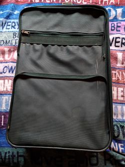 Small dark green suitcase