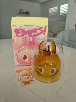 Labubu cheers glass