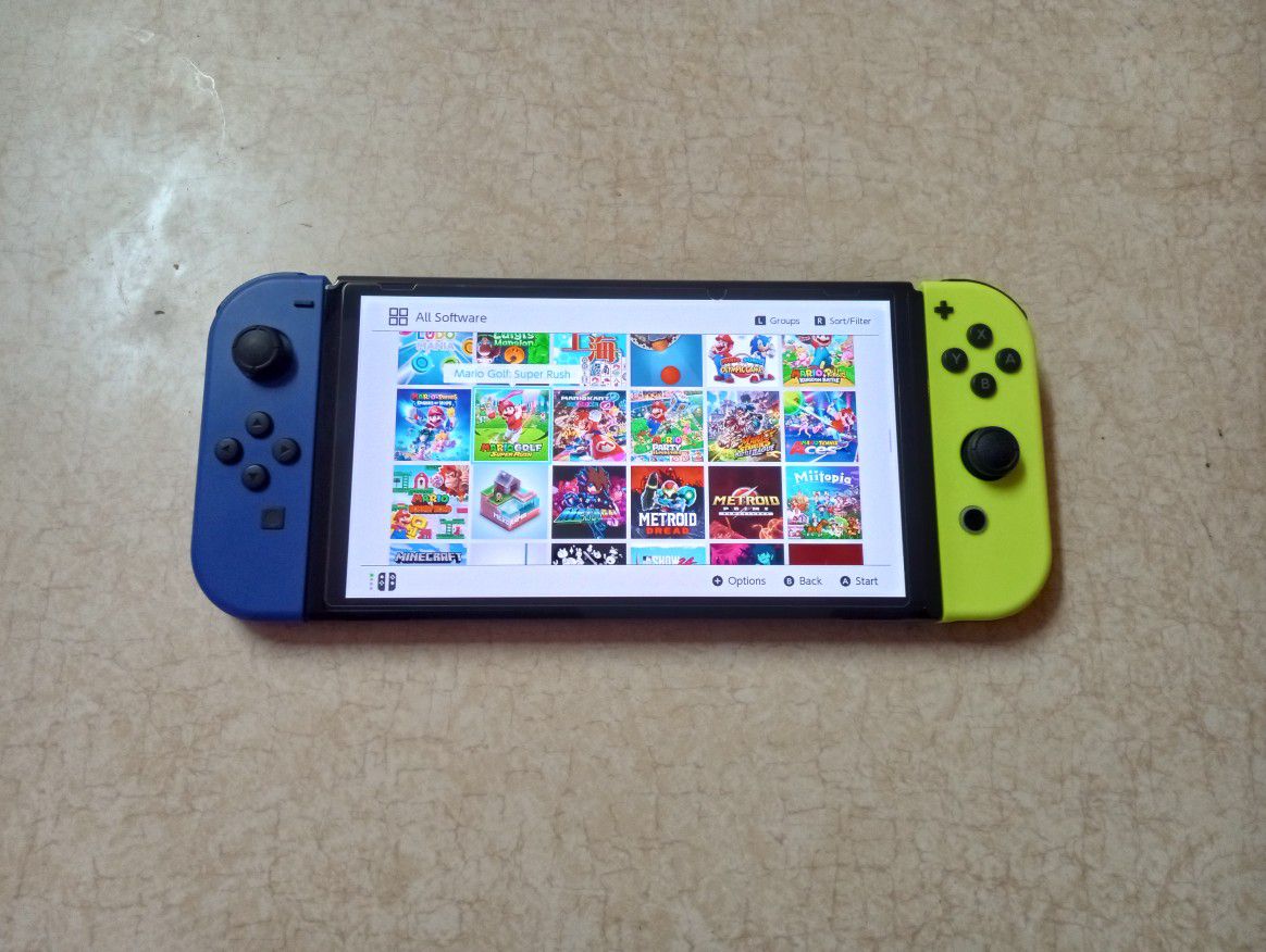 NINTENDO SWITCH OLED with Over 100 POPULAR SWITCH GAMES and 512GB MEMORY 