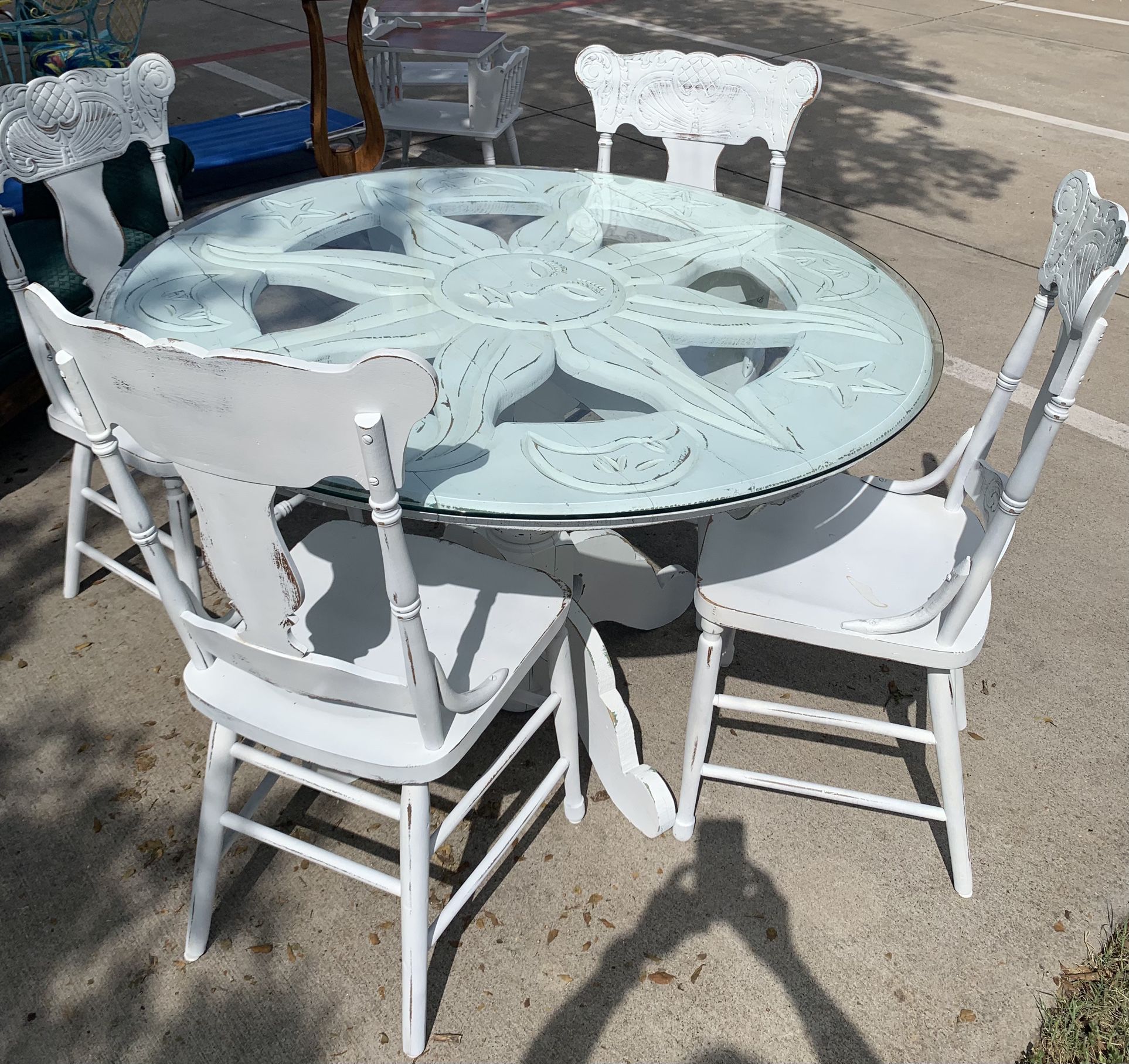 Savory Farm House Style, Distressed Sundial Pedestal Table With A Glass Top And 4 Distressed White Chairs