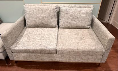 Gray Textured  Loveseat Sofa with Gold Metal Base.