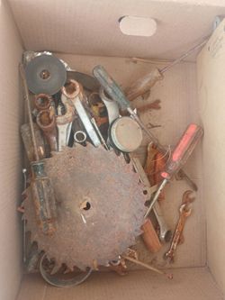 box of vintage, heavily oxidized hand tools