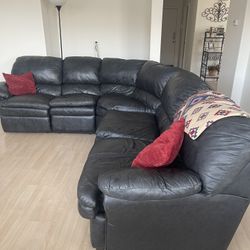 Large Black leather sectional sofa with bed couch