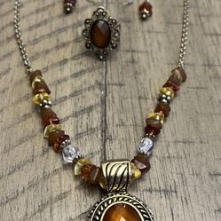 Gold toned necklace, earrings and ring set.