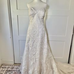 Wedding dress, cardigan, train veil, and scarf