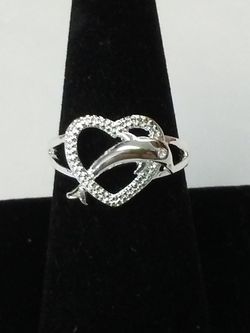 Heart with dolphin jumping through it sterling silver size 8