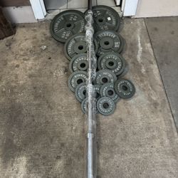 Olympic weights 255lbs total plus 7ft 45lbs bar