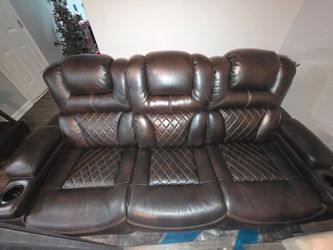 Brown leather sofa and loveseat