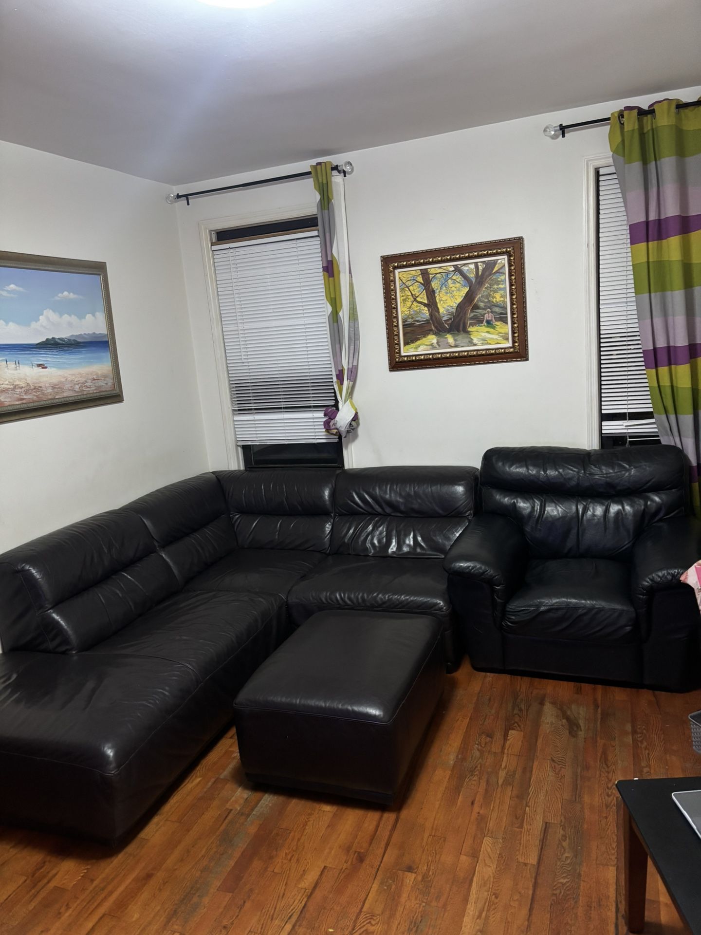 Black leather sectional + ottoman + armchair 