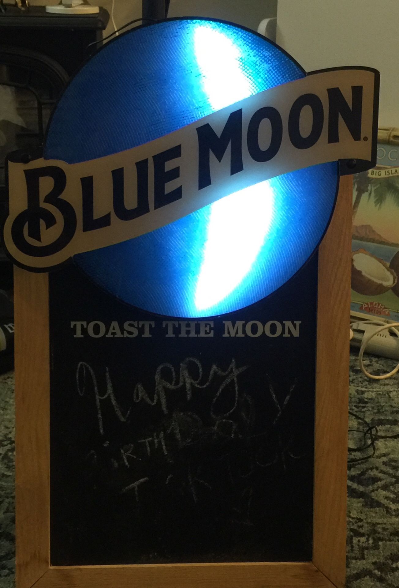 Light blue moon and chalk board sign