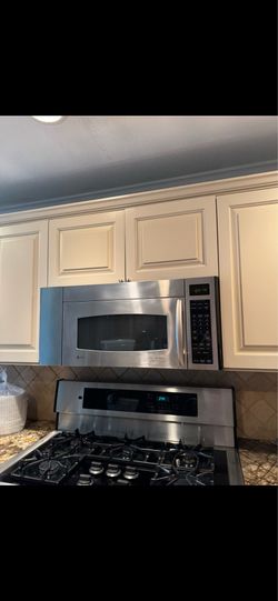 GE Profile Spacemaker Microwave with Vented Hood – Stainless Steel & Black