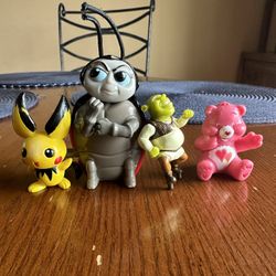 4 Small Toy collectibles. Pokémon , It's a bug's life, Shrek + Care Bear toys