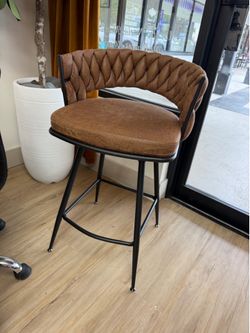 Bar stool high chair swivel. Brown leather suede w/ black legs.