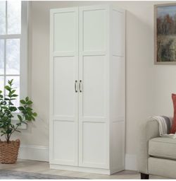 Brand new two door white tall cabinet