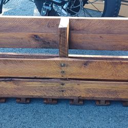 A CUSTOM MADE WINE RACK WITH WINE GLASSES HOLDERS