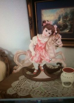 Little girl in a horse statue