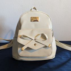 Super cute small cream and Gold Ihayner purse backpack