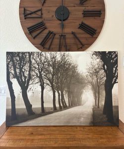 Black and White Foggy Tree-Lined Road Canvas Print