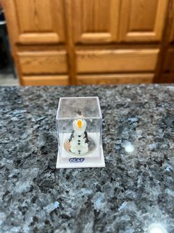 Disney Small 1 inch tall figure in a plastic case.  Preowned it’s been on display in a cabinet.  Smoke free home