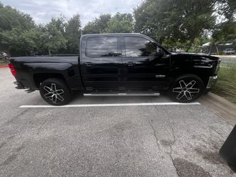 24” All terrain tires and BLACK AND CHROME RIMS