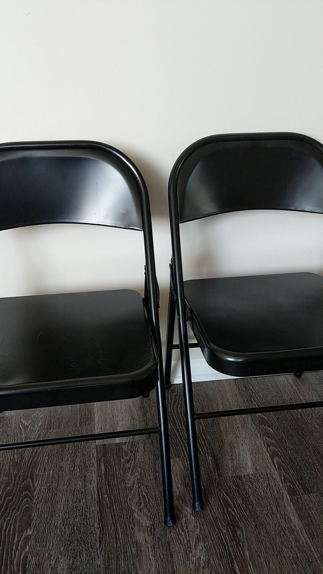 Two metal folding chairs
