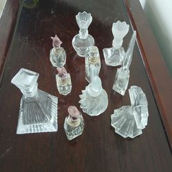 collection of vintage-style and antique-style cut crystal perfume bottles
