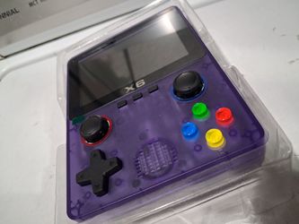 X6 Handheld retro video game console in transparent purple.  New.   fully laminated IPS OCA screen.  Features a dual 3D rocker design 4- core 32 bit p