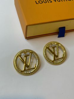 Some gold-colored earrings