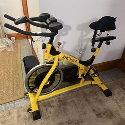 Like new Ancheer yellow indoor exercise bike