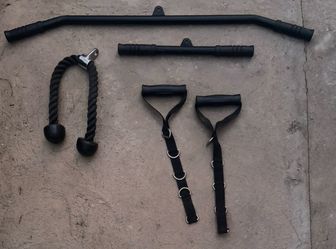 Cable machine with all attachments and a barbell