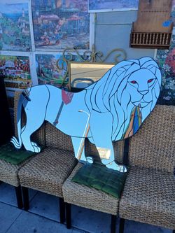 large, custom-cut lion-shaped walking mirror
