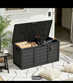 75 gallons Durable plastic storage box is black with a wood-grain texture. It has a hinged lid and integrated side handles for transport. The construc