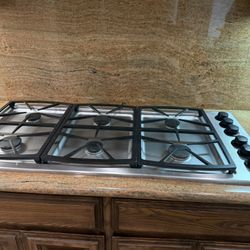 Stainless Gas Stove And Thermador Vent Hood 