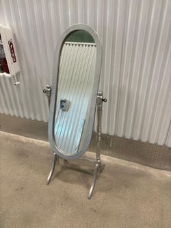 Silver Queen Anne mirror.. 57 “ high x 21” wide . $75