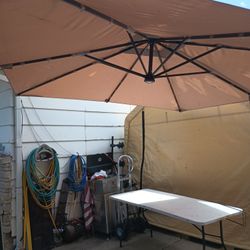 10 1/2' X 6' Rectangle Umbrella (Missing The Solar Panel For The Light) Base Can Be Filled With Sand Or Eater