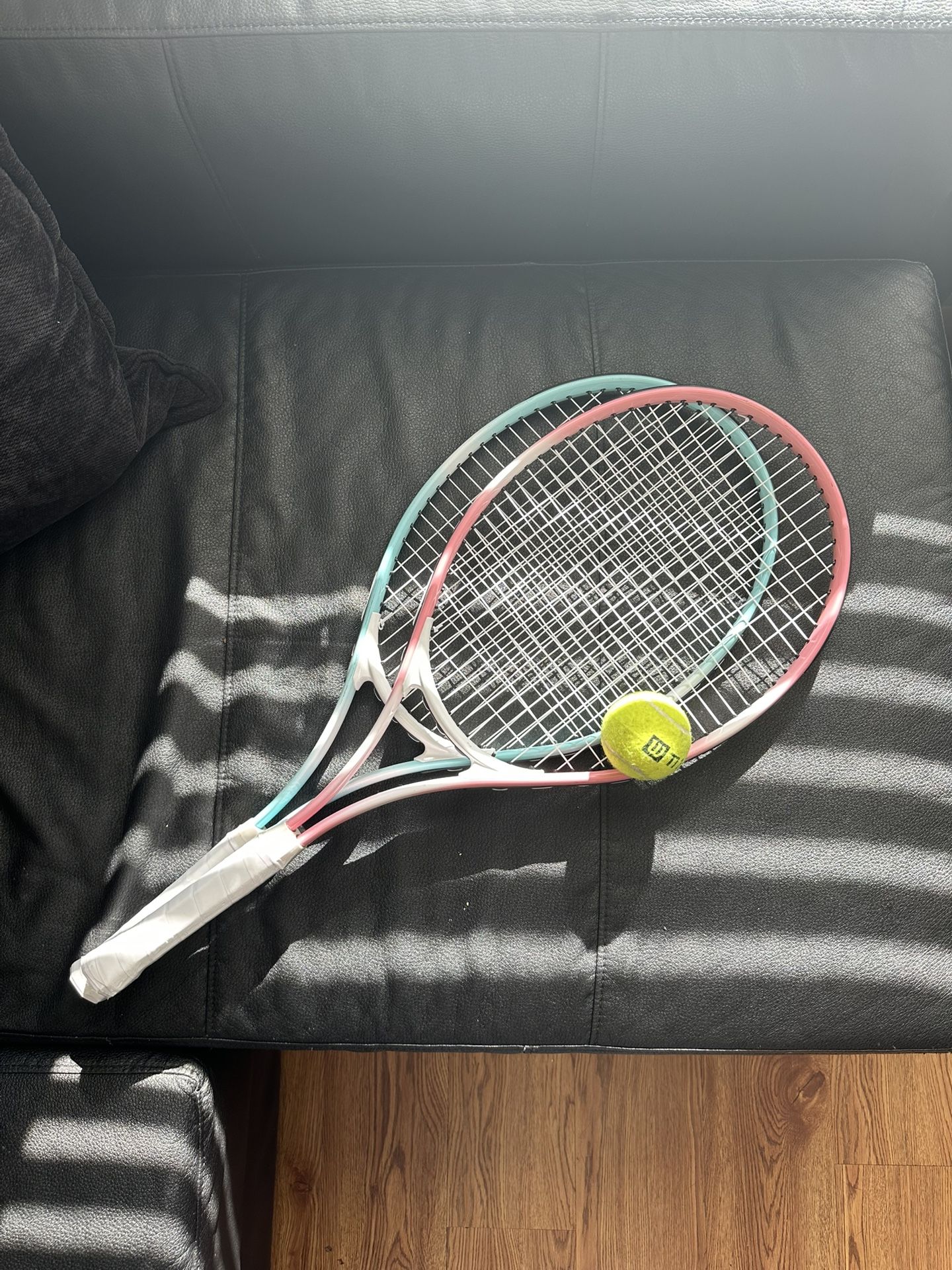 2 tennis rackets for adults and 1 tennis ball