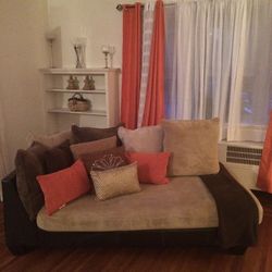 Two Brown Couches Coffee Table With Pillows 