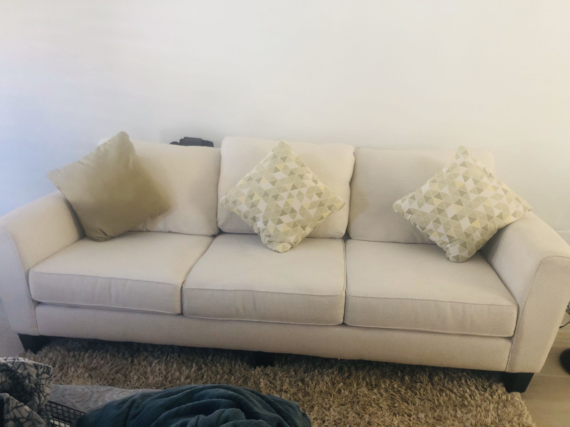 White comfortable couch+ottoman from Living Spaces